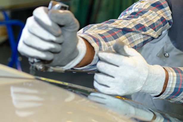 Person fixing windscreen